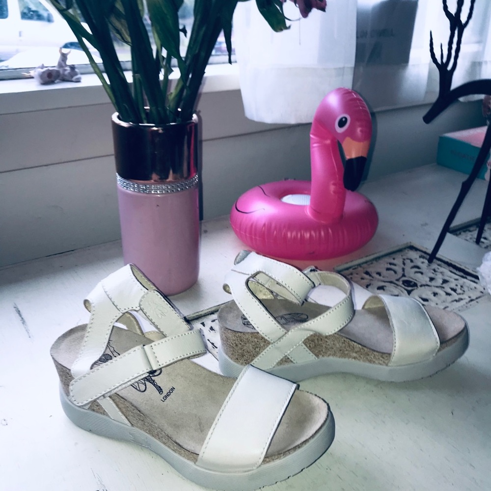 London Fly off white sandals.